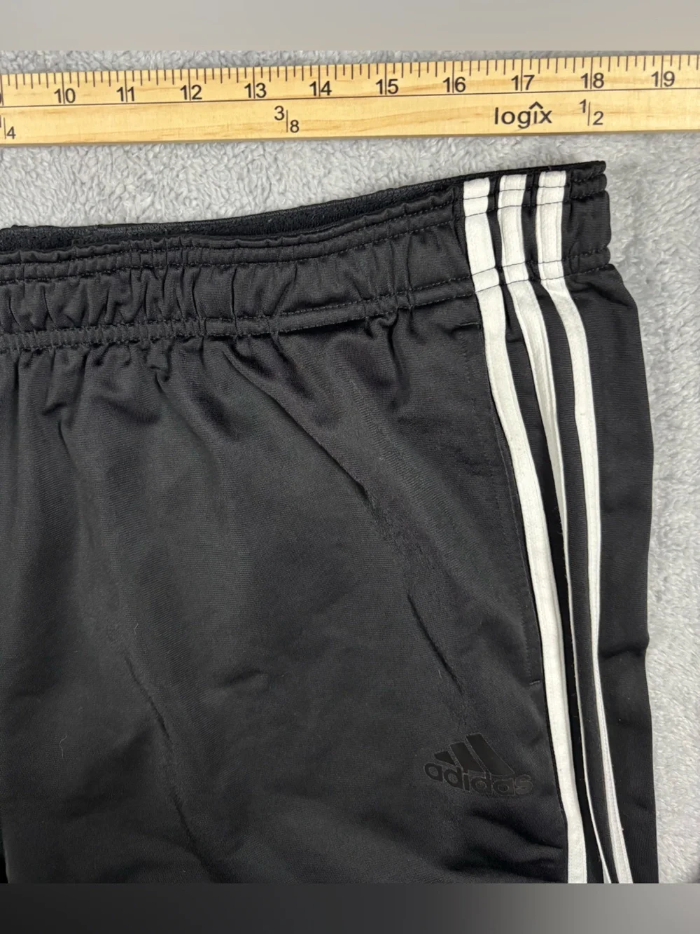 Adidas black track pants with white stripes
